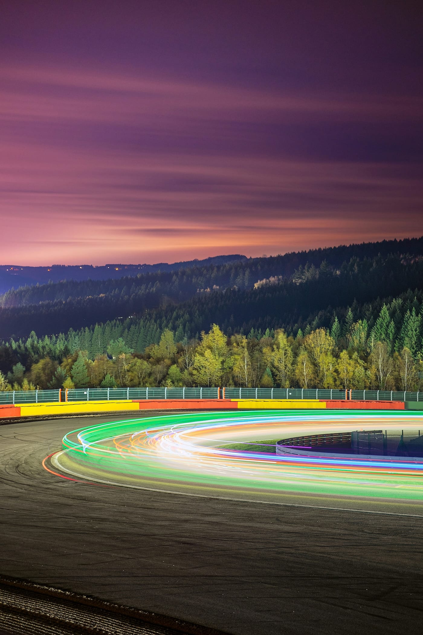 Long exposure lights of race cars at night at the Spa-Francorchamps track